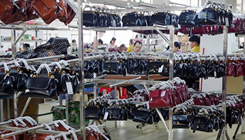 Inspecting finished handbags and the package